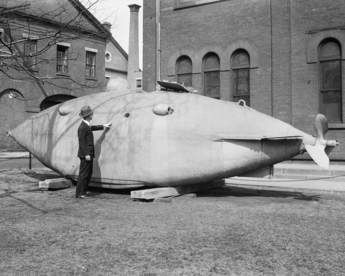 1930s MAN STANDING NEXT TO...