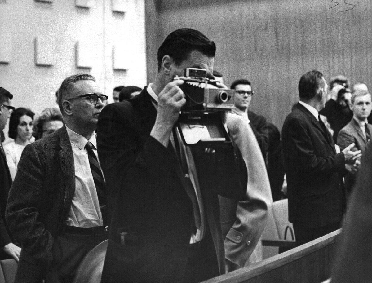 APR 7 1965, APR 8 1965; GEORGE LINCOLN ROCKWELL USES POLAROID CAMERA; He took photos of Mrs. Joan Ga