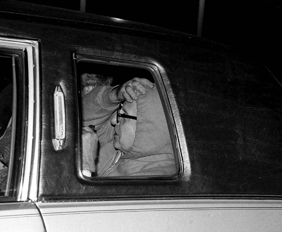 Carmine Galante, clad in hooded sweatshirt, leaves Newark Ai