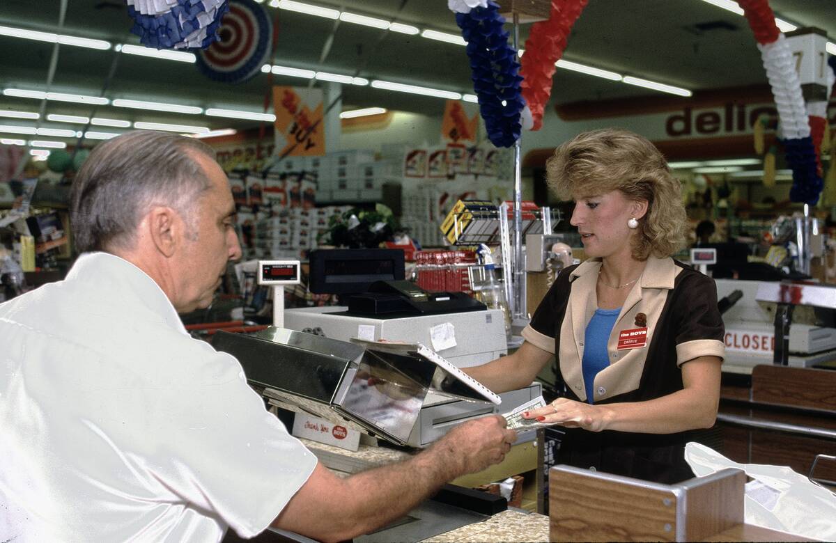 Consumers Shopping For Groceries At Supermarket