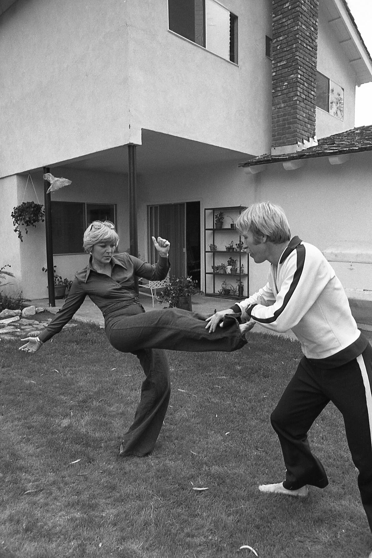 Movie Actor Chuck Norris Practices Kick Moves at Home in Southern California