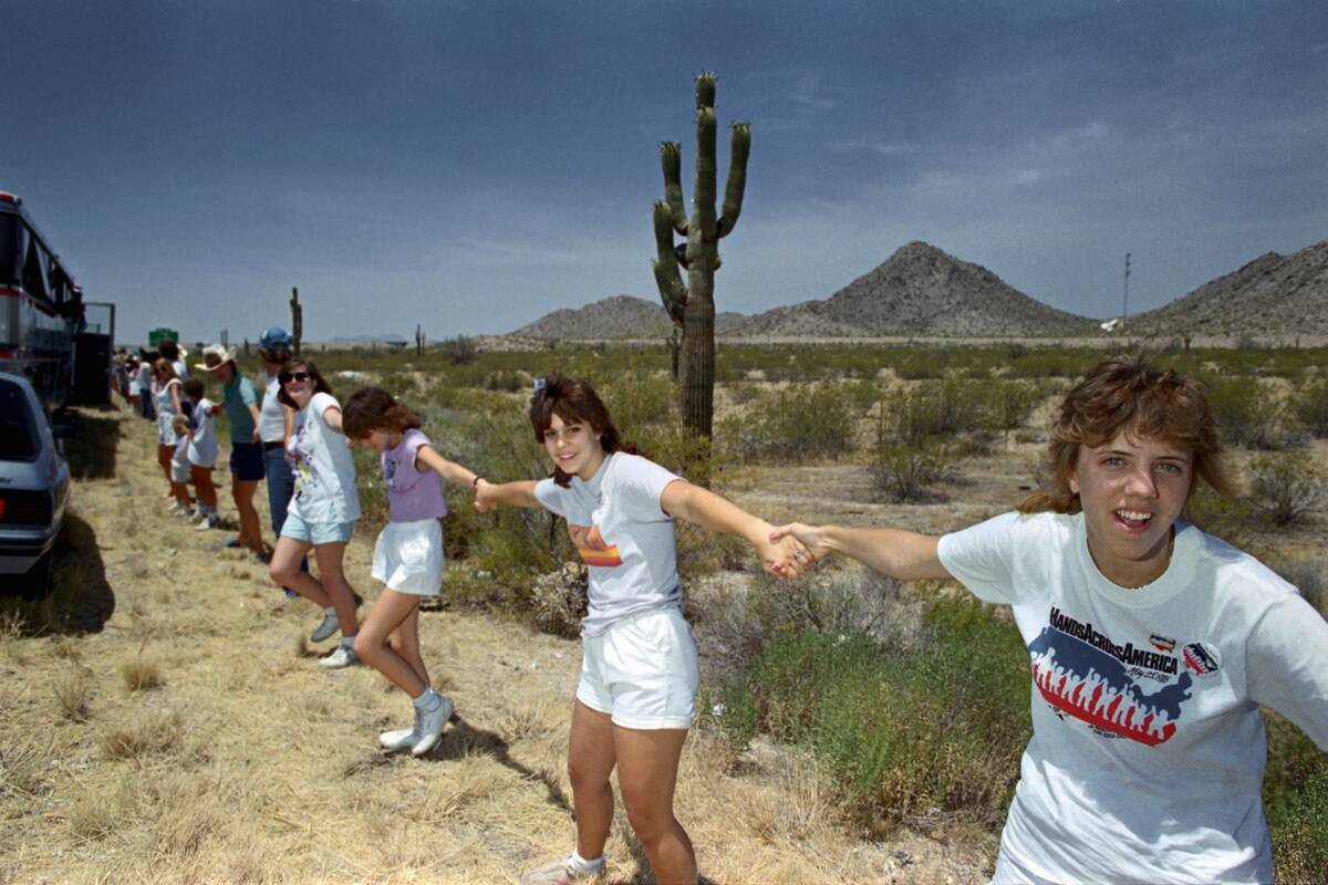 People Forming Human Chain in Hands Across America