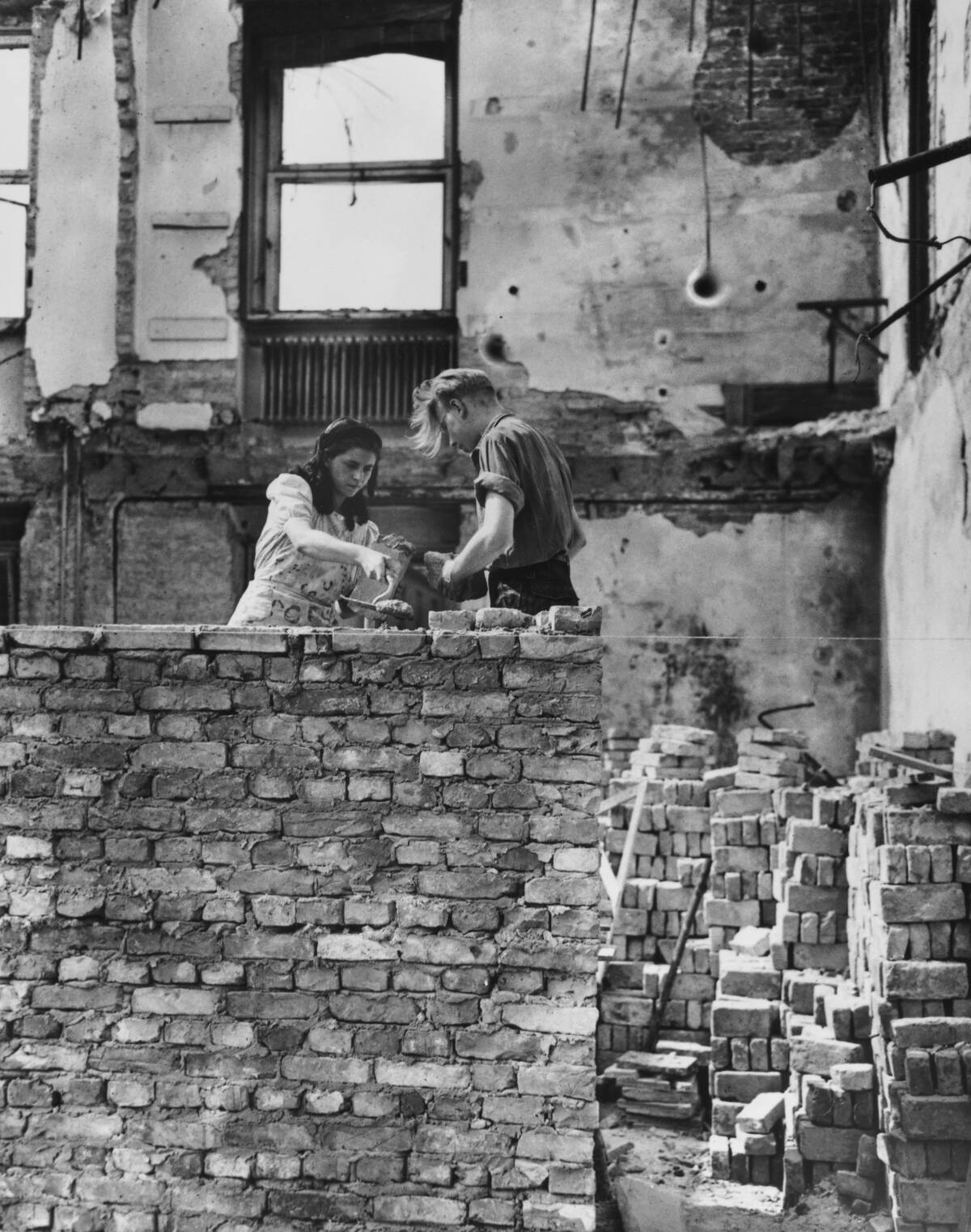 People Laying Bricks In Post-War Germany
