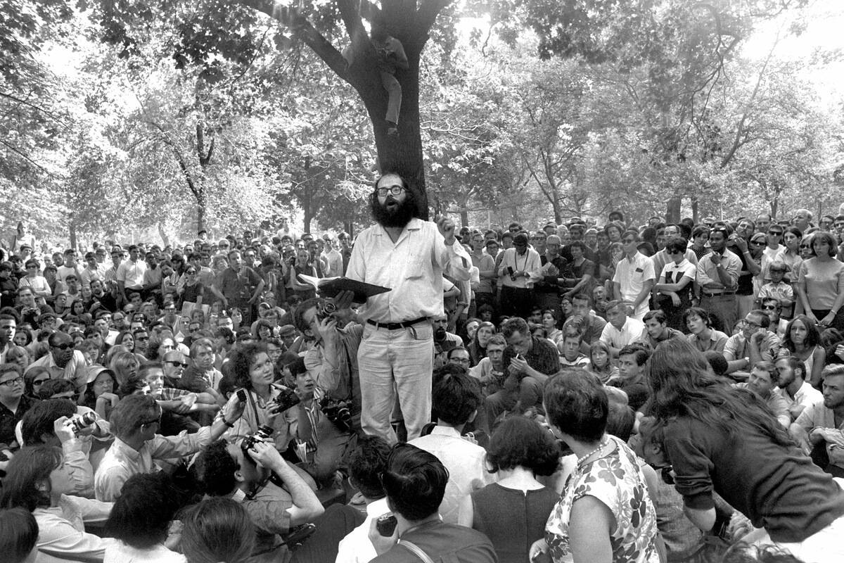 Poet Allen Ginsberg reading his work to a crowd in Washingto