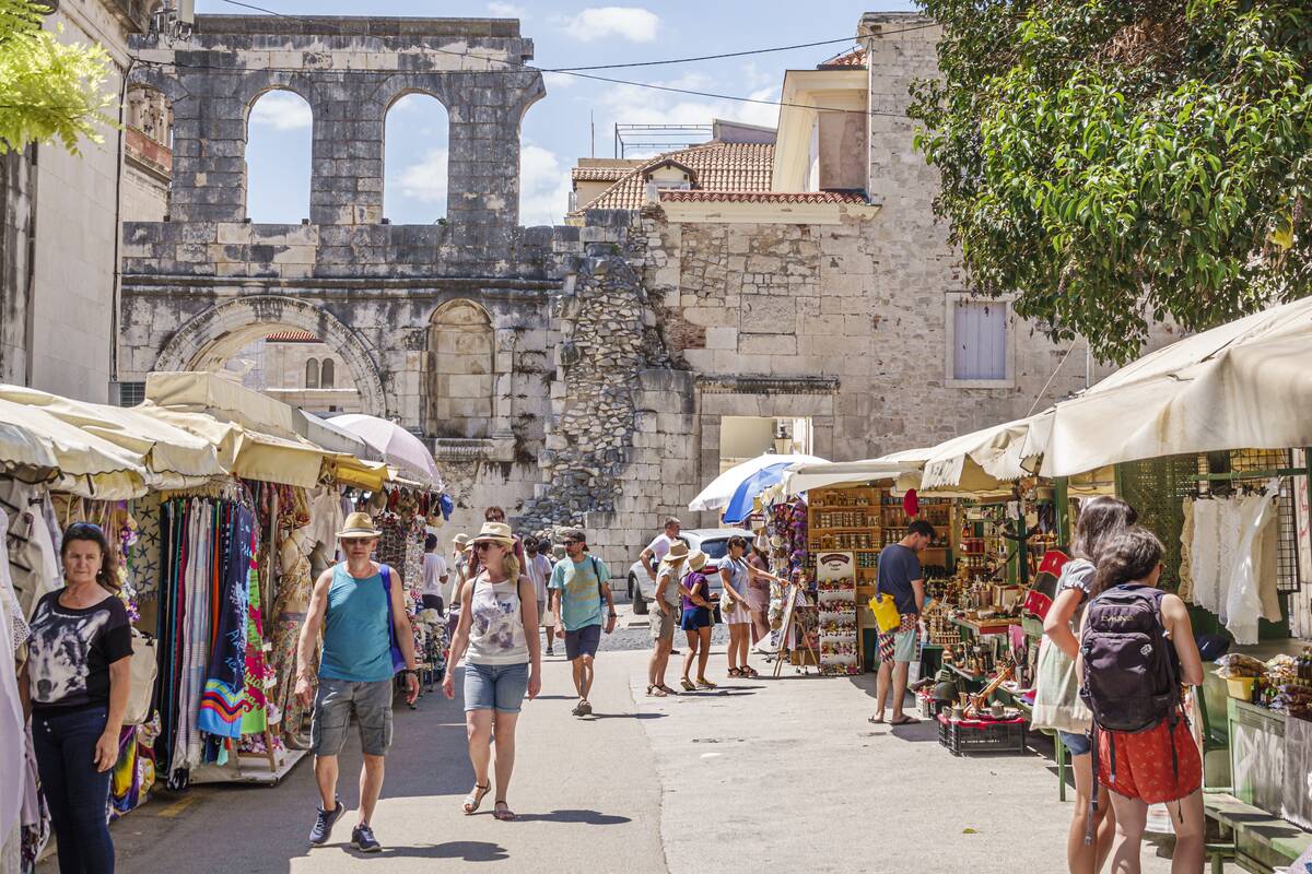 Split, Croatia, Old Town, Silver Gate Srebrena vrata, historical landmark, Diocletian's Palace entrance, vendors stalls, souvenirs crafts locally made products
