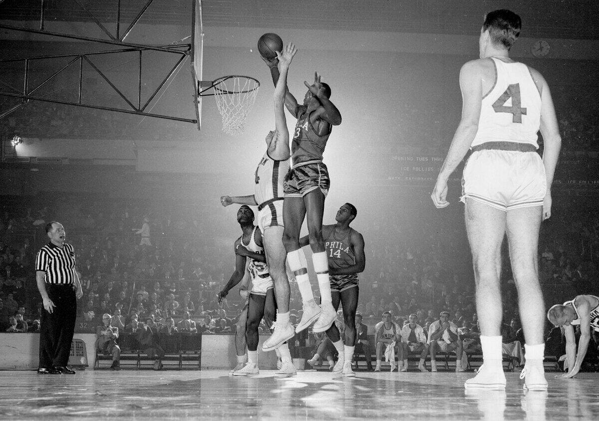 Wilt Chamberlain, Philadelphia's sensational rookie, lays on