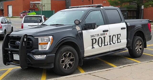 2021_Ford_F-150_XL_Police_Responder_in_Agate_Black_Metallic_(Sault_Ste._Marie_Police_-12),_Front_Left,_11-11-2022