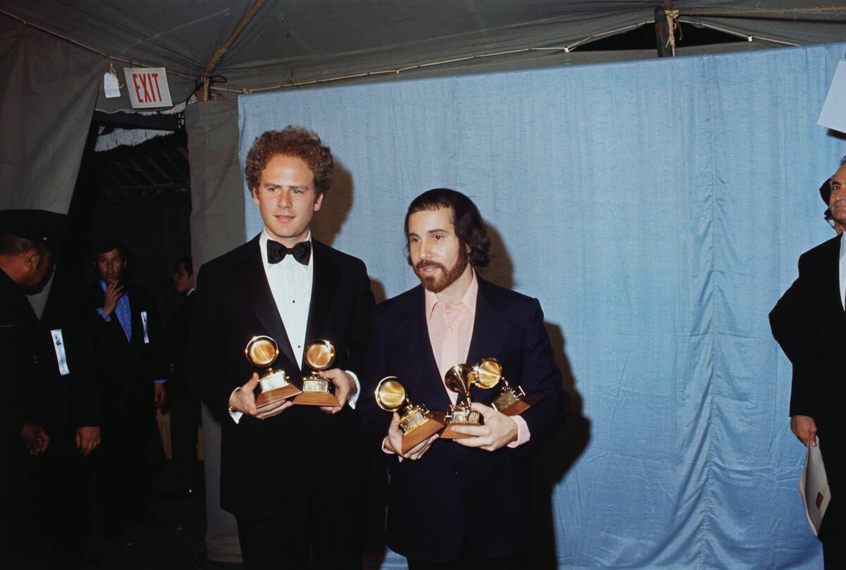 Art Garfunkel and Paul Simon Holding Grammy Awards
