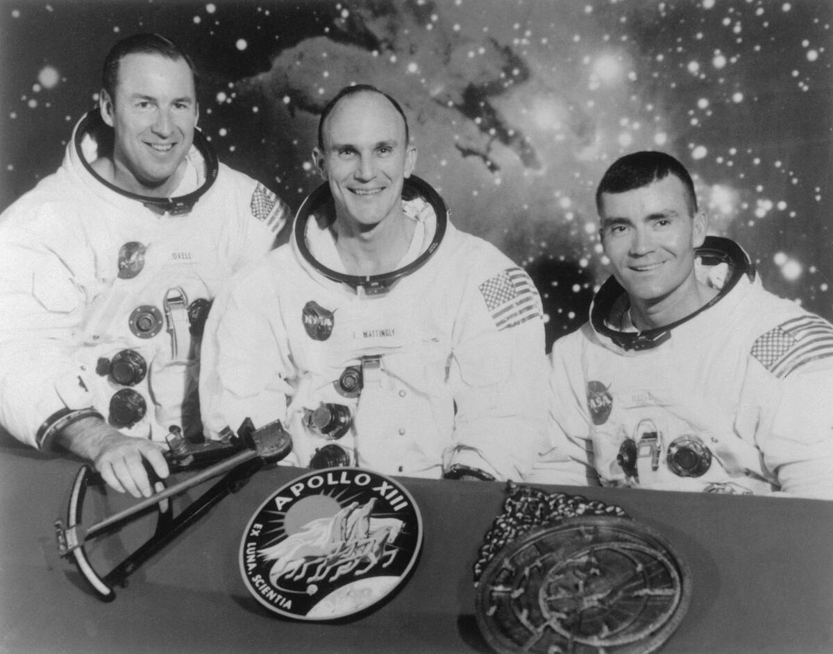 Astronauts Posing with Apollo Insignia