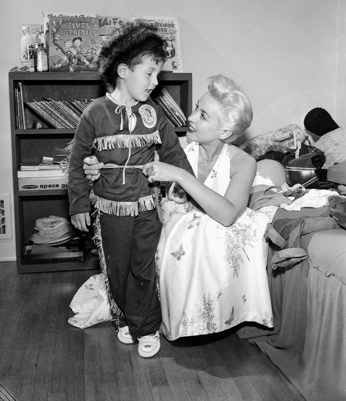 Boy Getting Dressed as Davy Crockett