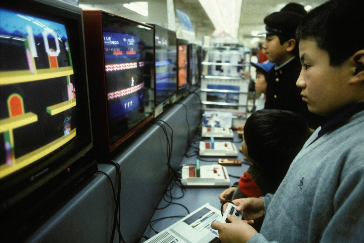 Children Playing Famicon Video Games In Shop