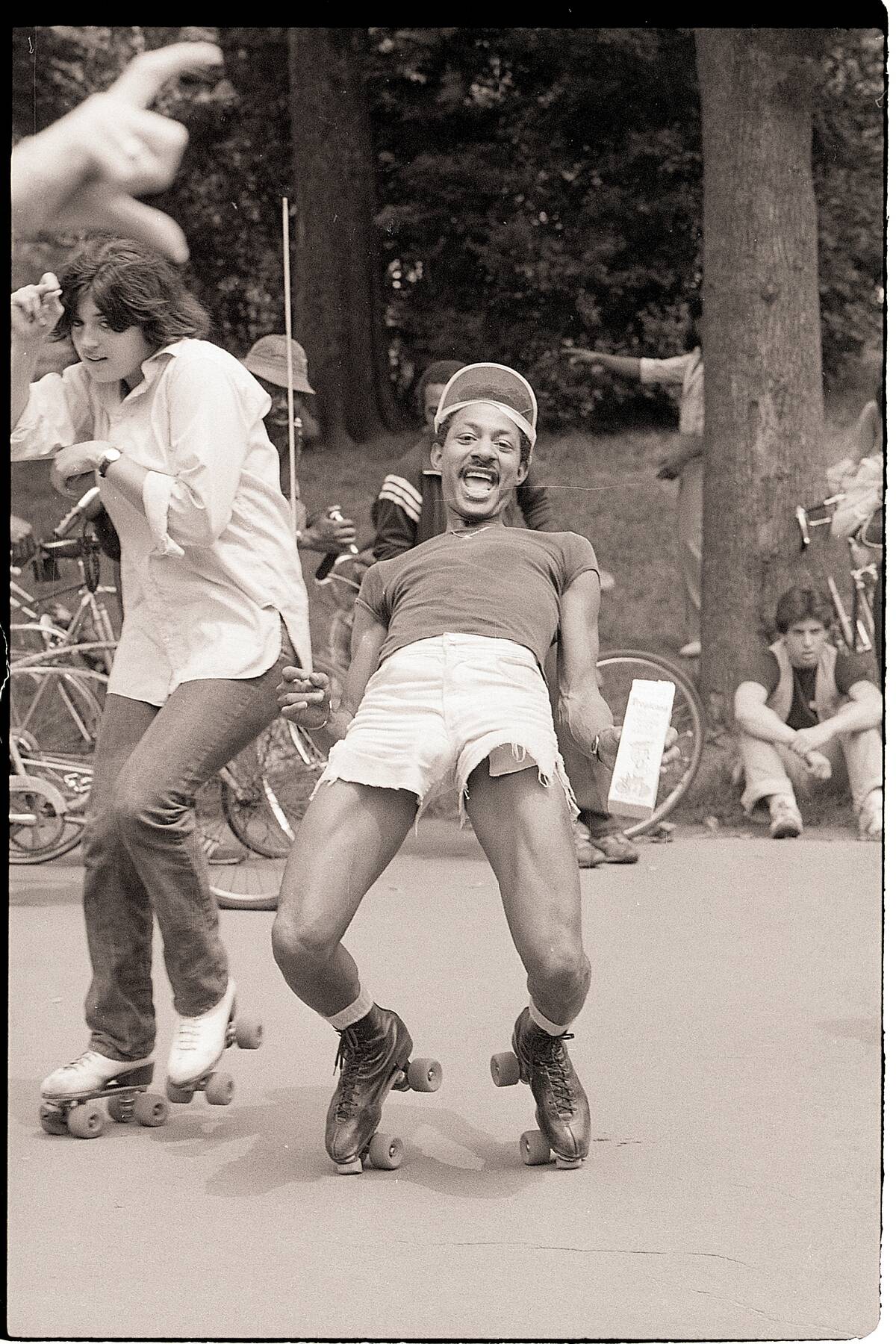 Man Limbos While Roller Skating