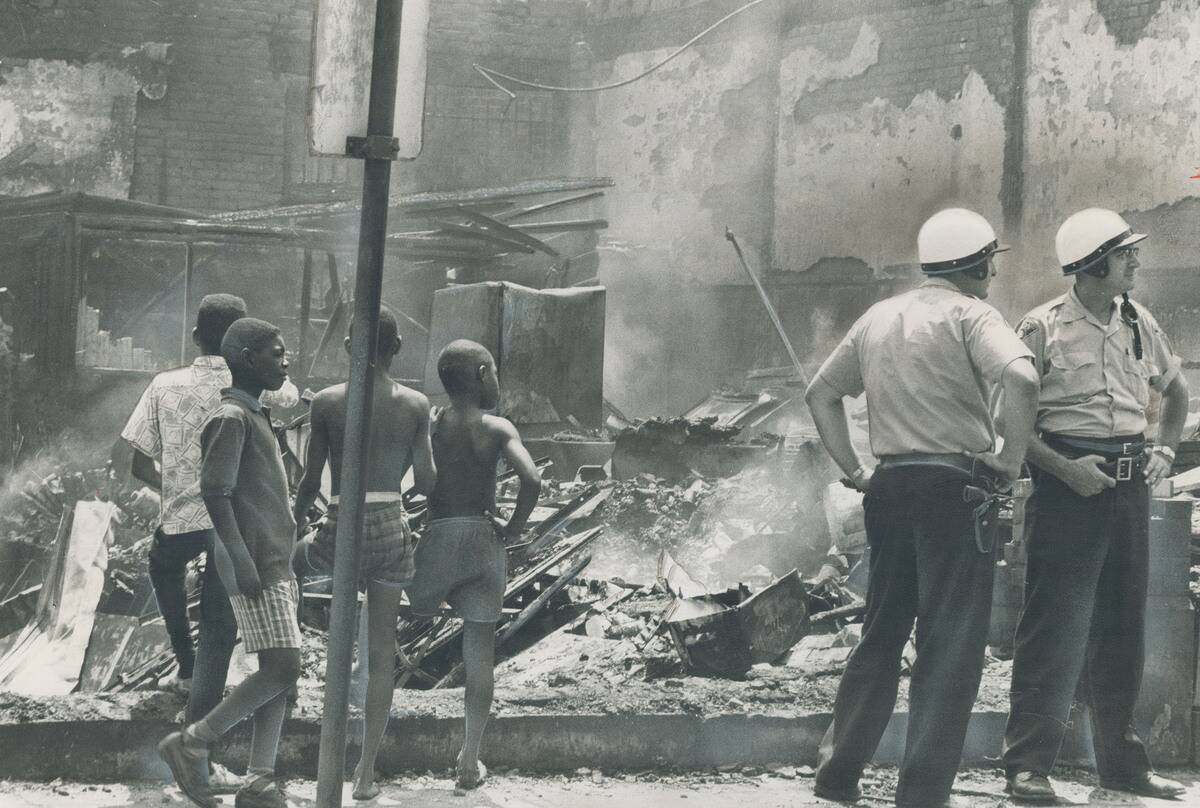 National Guardsmen restore an uneasy peace to riot-torn cleveland; Negro district exploded into viol...
