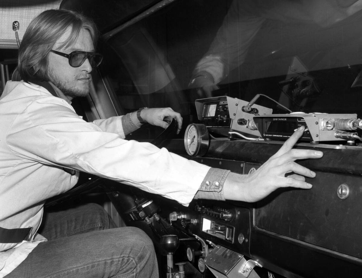 Nuturn Worker Adjusts Controls in Large Truck
