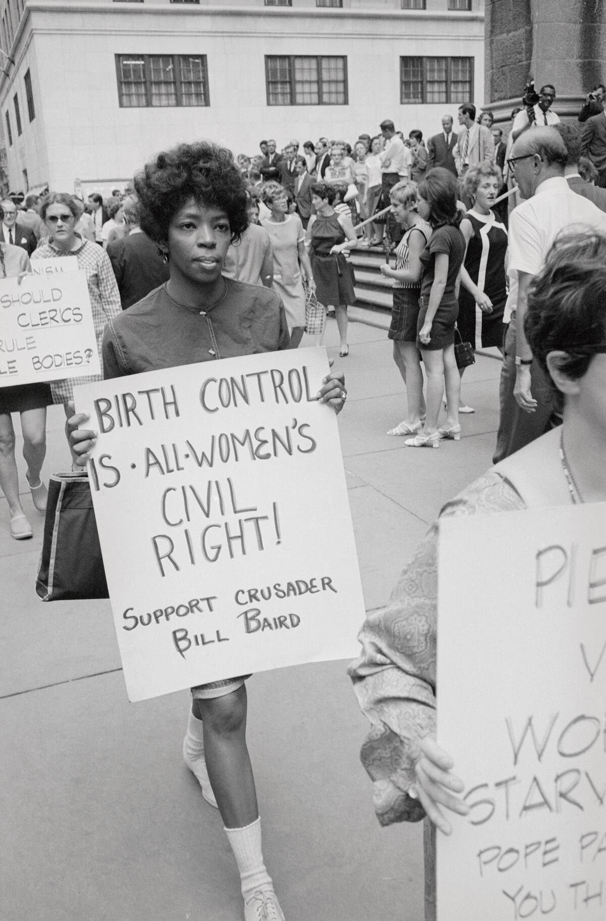 Protesters Carrying Signs on Birth Control