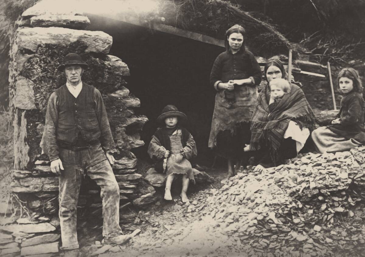 The Great Famine. A Family At The Ruins Of Their House In Killarney