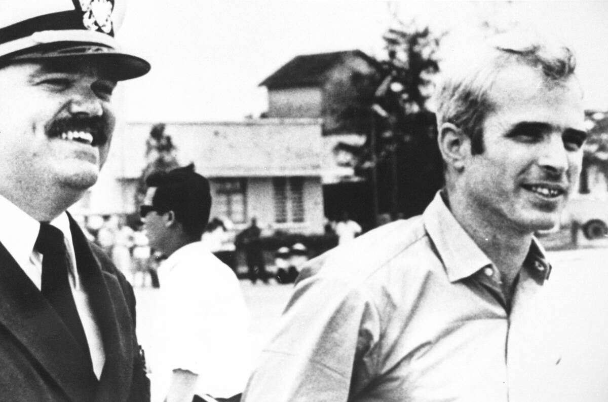 U S Navy Lt Cmdr Jay Coupe Left Escorts Lt Cmdr John Mccain To A Wai