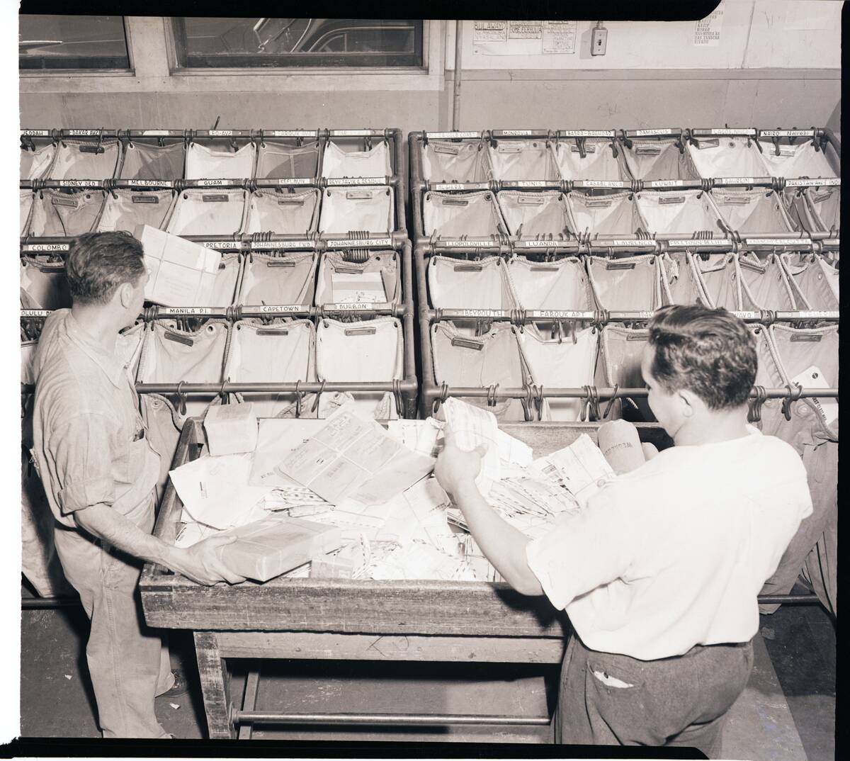 Workers Sort Letters into Airmail Bags
