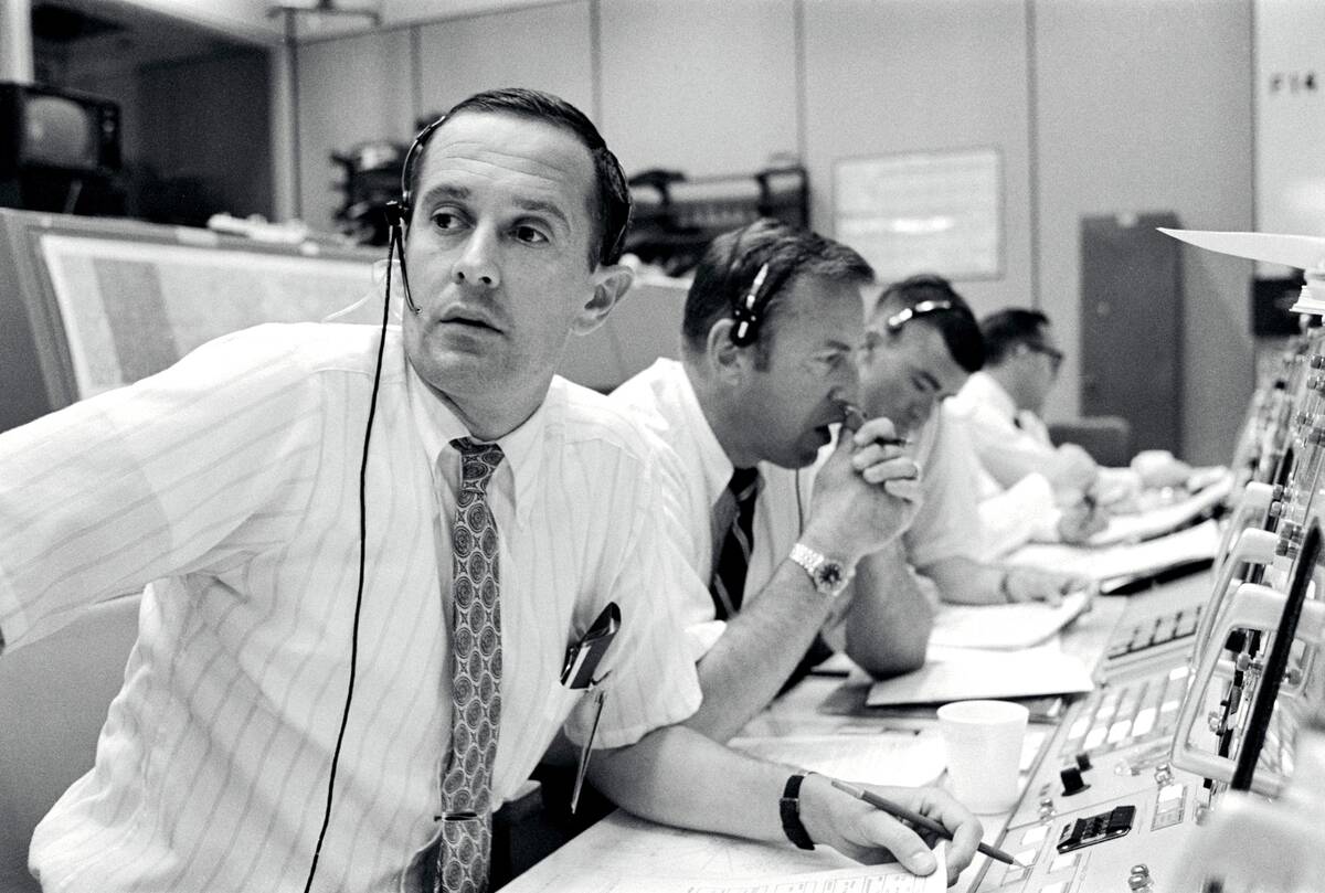 Black and white photo of NASA mission control (unknown if Florida or Houston)