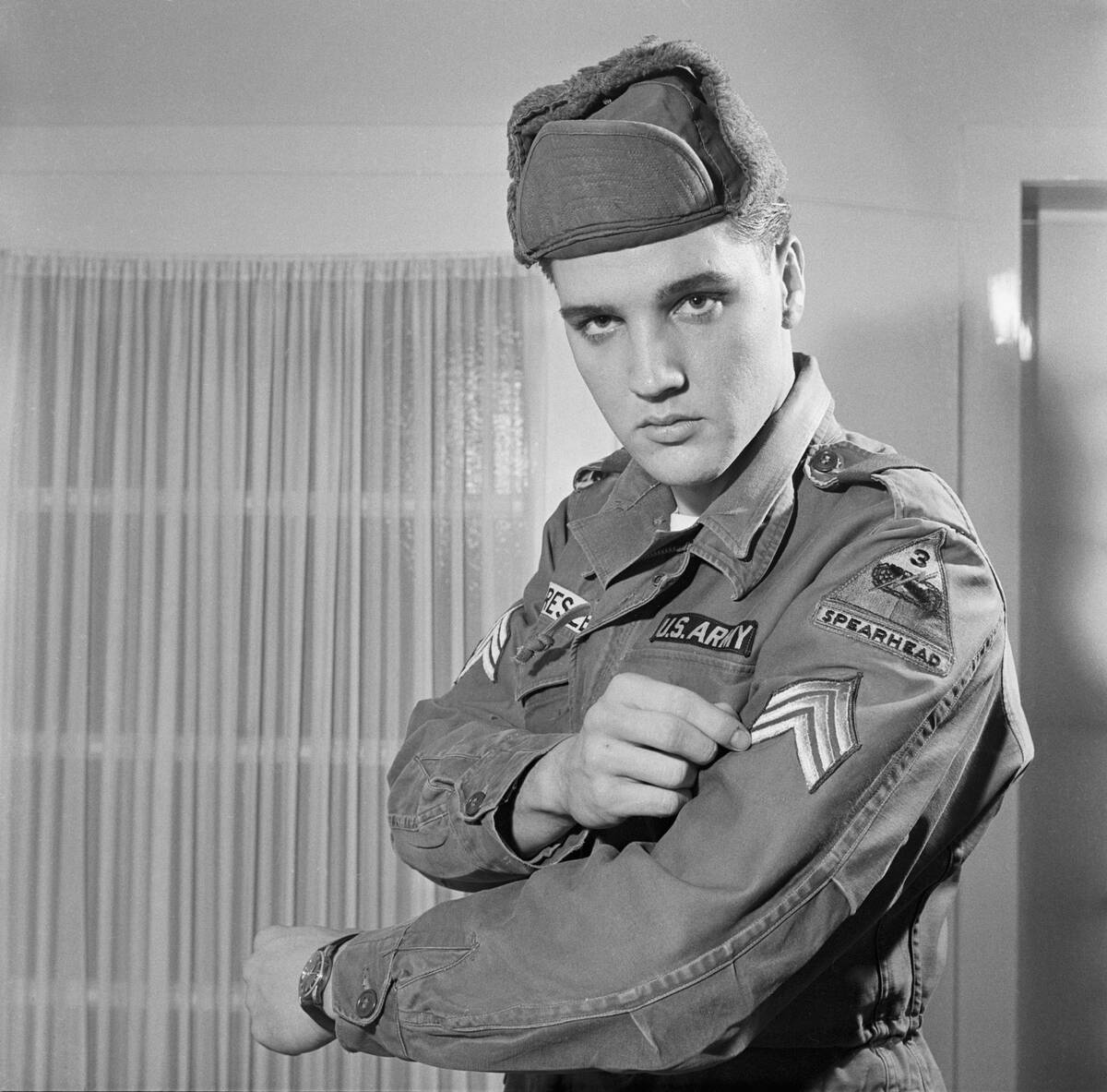 Elvis Presley Showing His Army Stripes