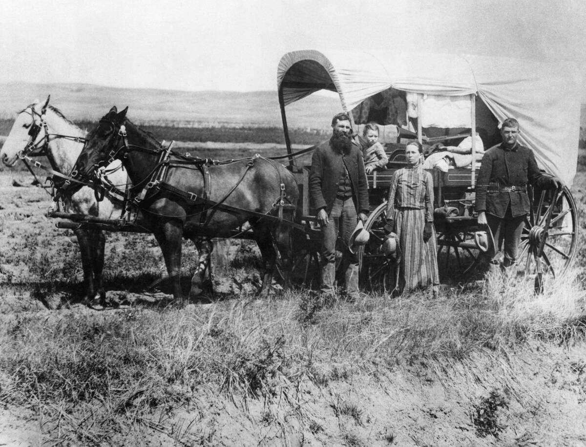 Emigrants Moving with Covered Wagon