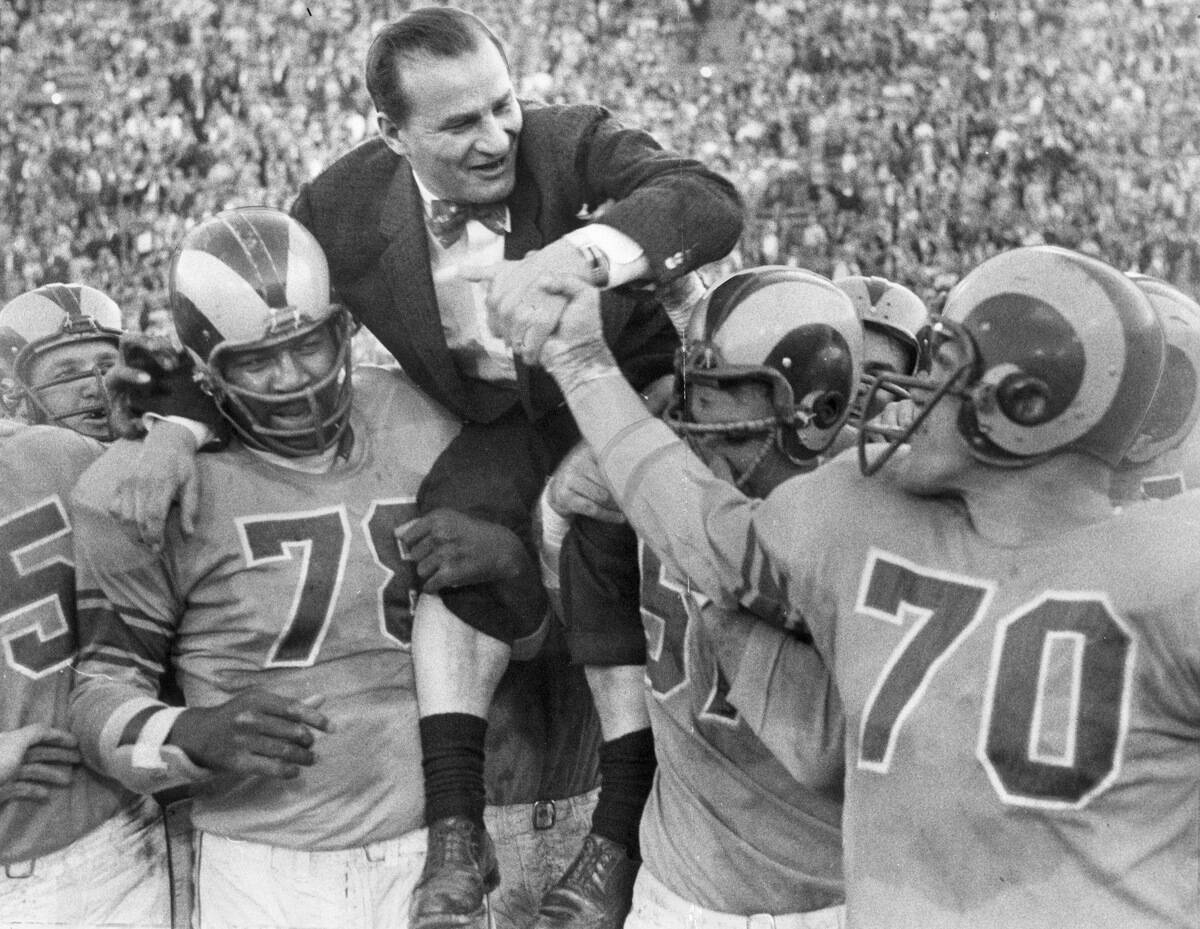 Los Angeles Rams coach Sid Gillman is hoisted on the shoulders of Gene Lipscomb(left)and Don Paul(ce