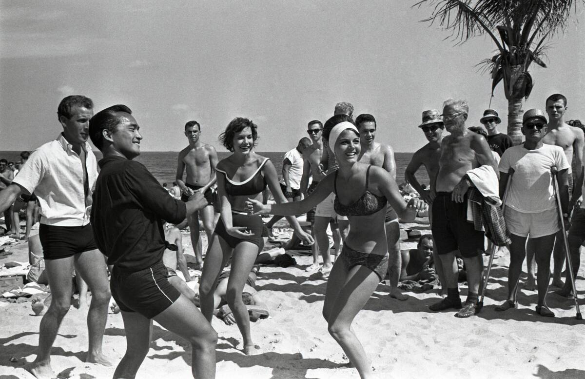 Two College Women Dancing on Beach
