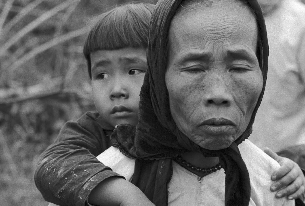 Vietnamese Refugees Sadly Leaving Their Village