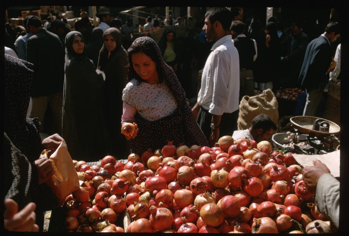 Woman Buying Fruit in a Teheran Market