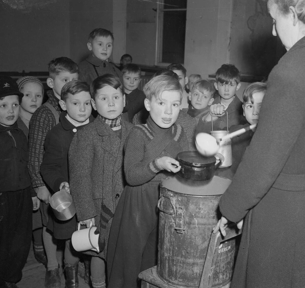 Young Children Waiting in Food Line