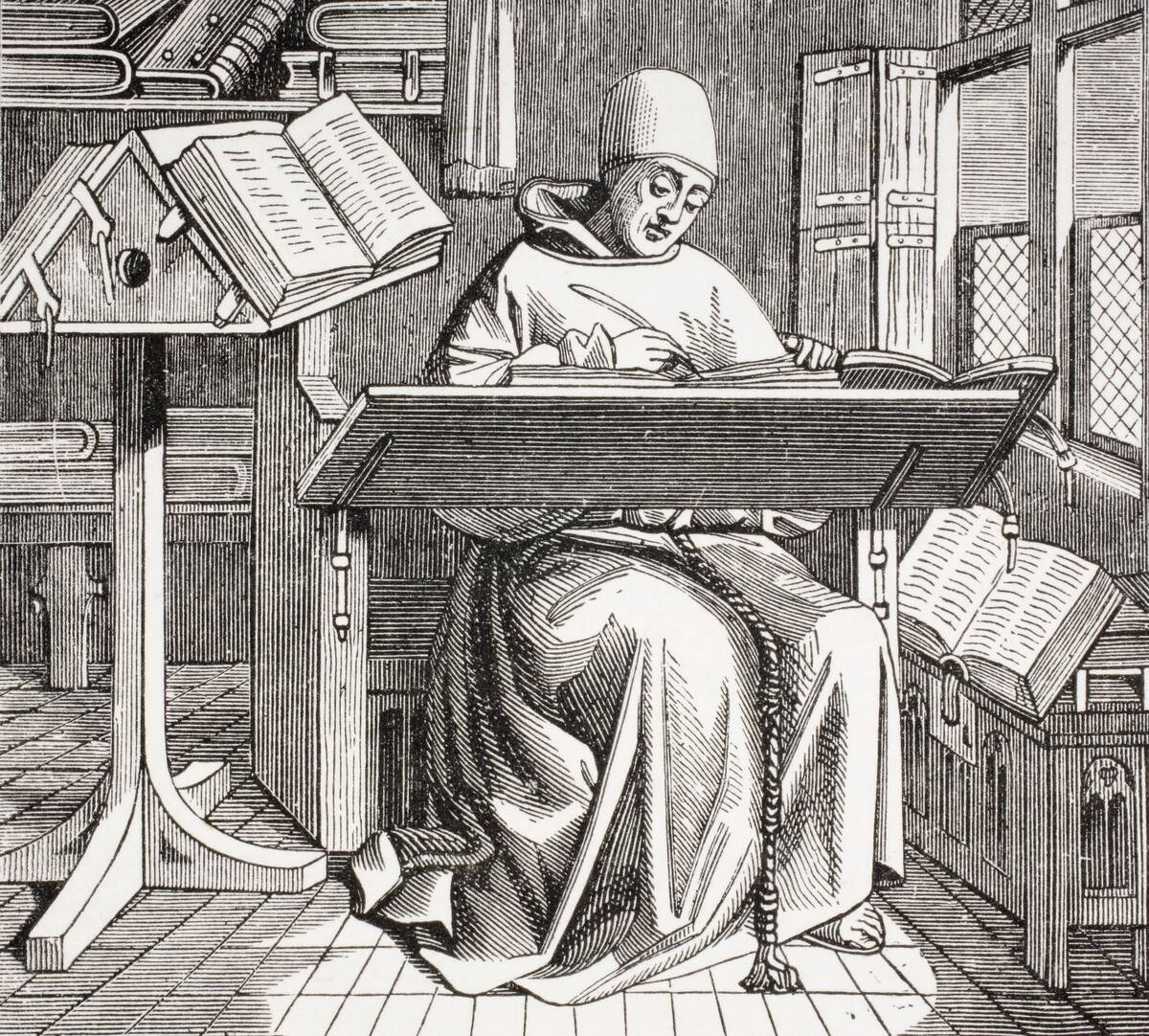 A Monk Scribe Surrounded By Manuscripts And Books Writing At His Desk