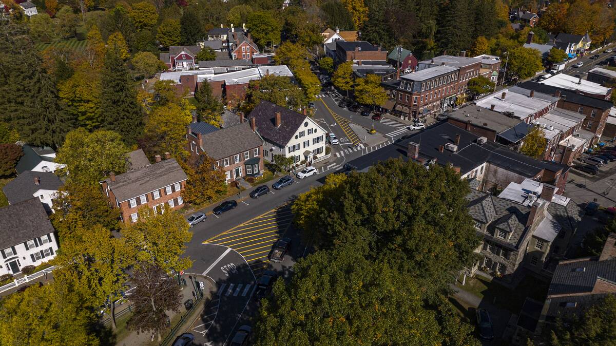 Aerial view of homes of scenic Woodstock Vermont, New England in autumn color