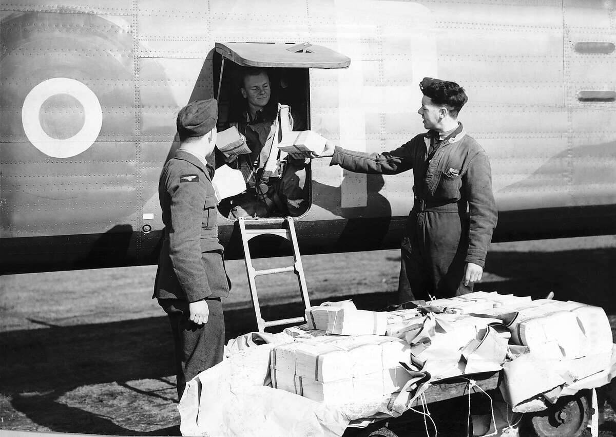 British airmen load a bomber with propaganda leaflets