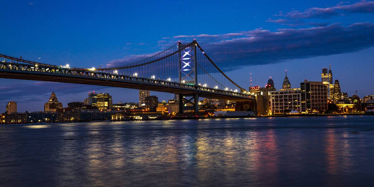 City lights on Ben Franklin Bridge and Philadelphia from Cooper Point, Camden New Jersey