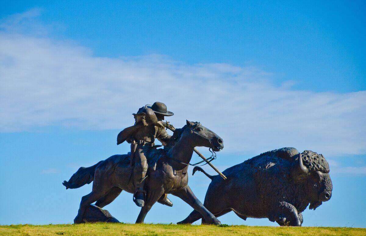 Kansas, Oakley, Buffalo Bill Cultural Center, Sculpture of Cowboy Shooting Buffalo