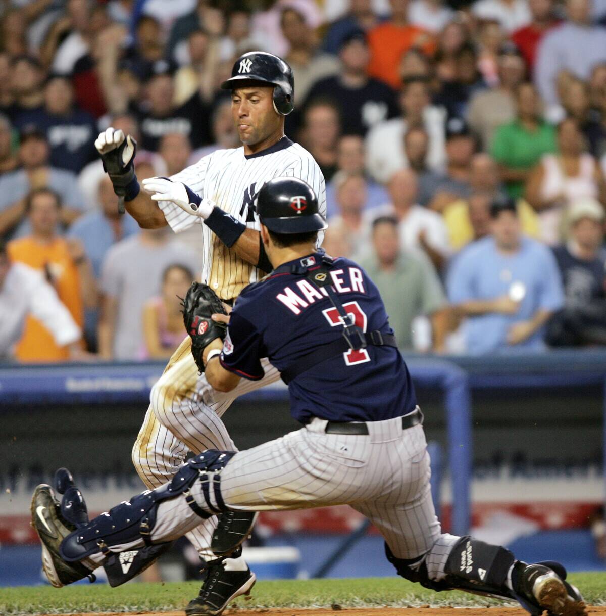 New York Yankees' Derek Jeter is tagged out at home base by
