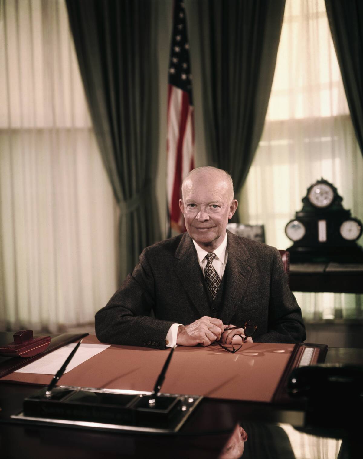 President Eisenhower Sitting at Desk in Oval Office