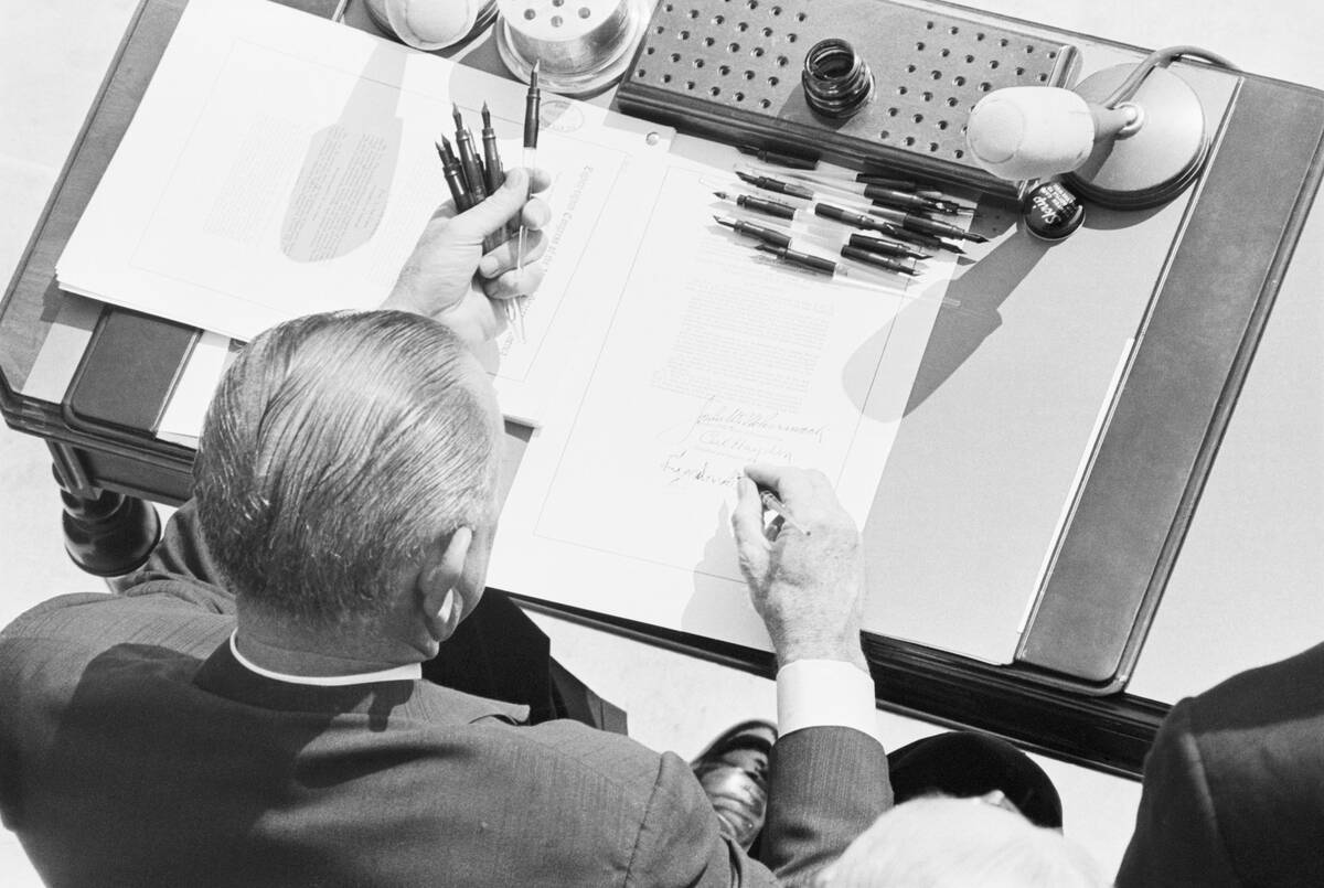 President Johnson Signing Poverty Bill