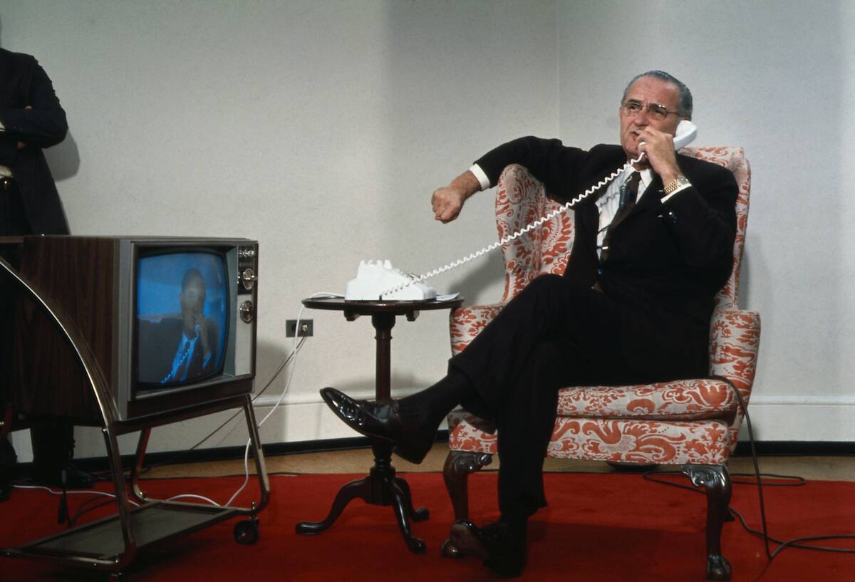 President Lyndon Johnson Sitting in Chair and on Phone