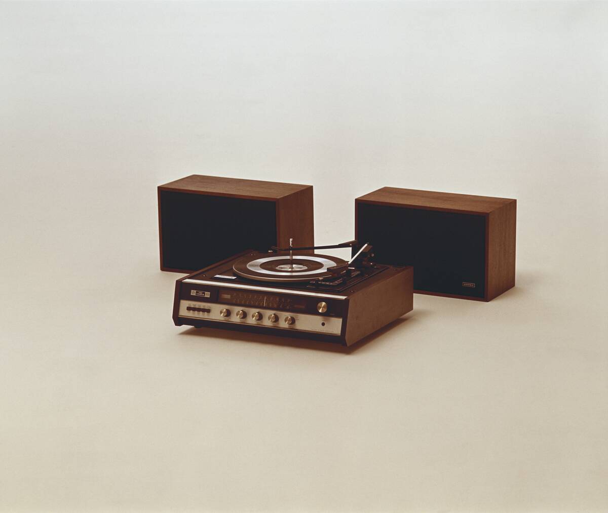 Record player and speakers on white background