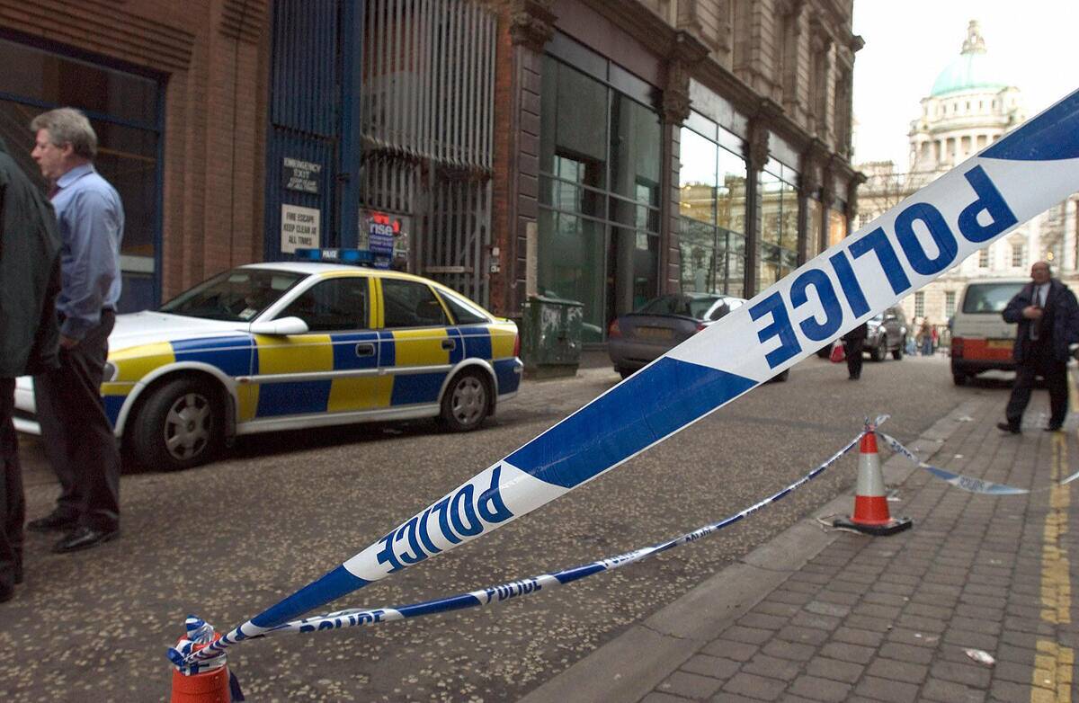 A police line tapes off the side of the