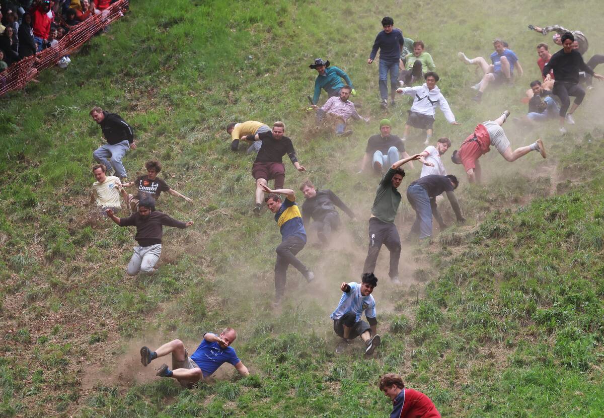 Annual Cooper's Hill Cheese-Rolling Event Takes Place In Gloucester
