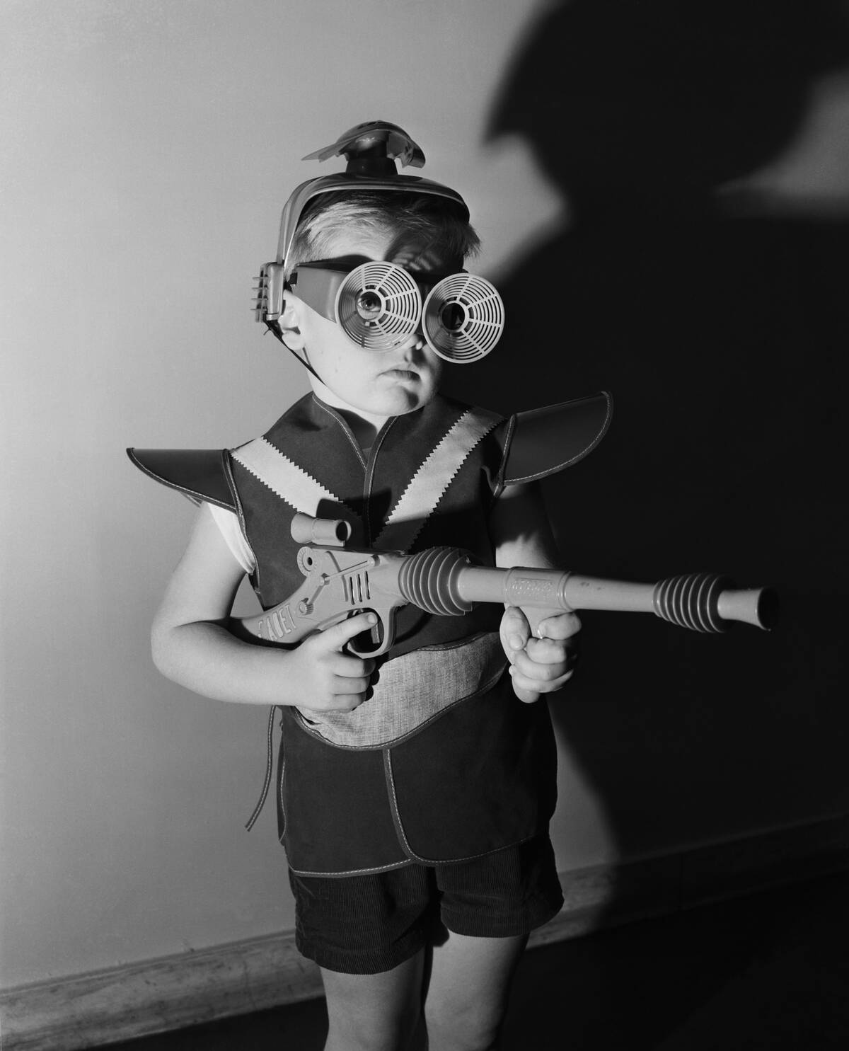 Boy Wearing Spacesuit Costume with Toy Gun
