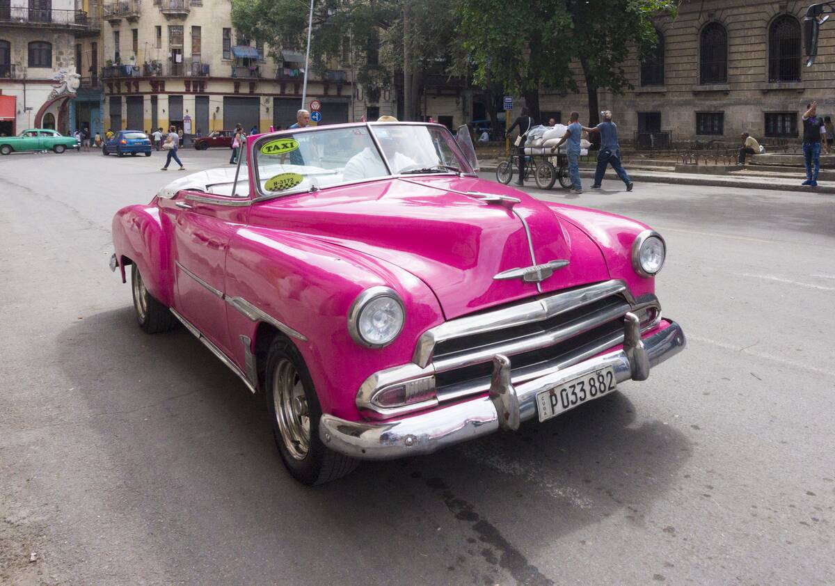Colorful convertible old obsolete American cars or vehicles...