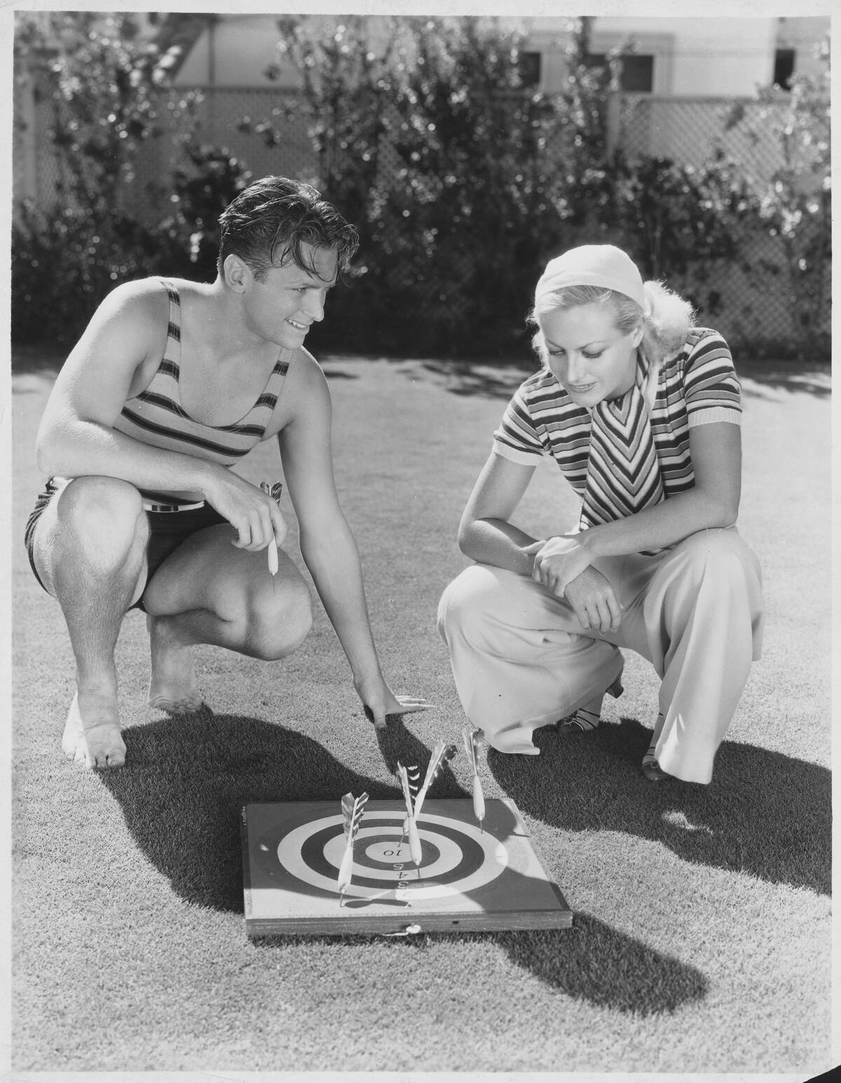 Douglas Fairbanks, Jr. and Joan Crawford Playing Darts