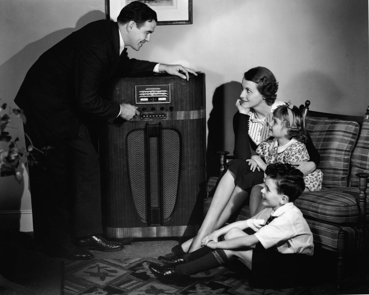 Family Listening To Radio At Home