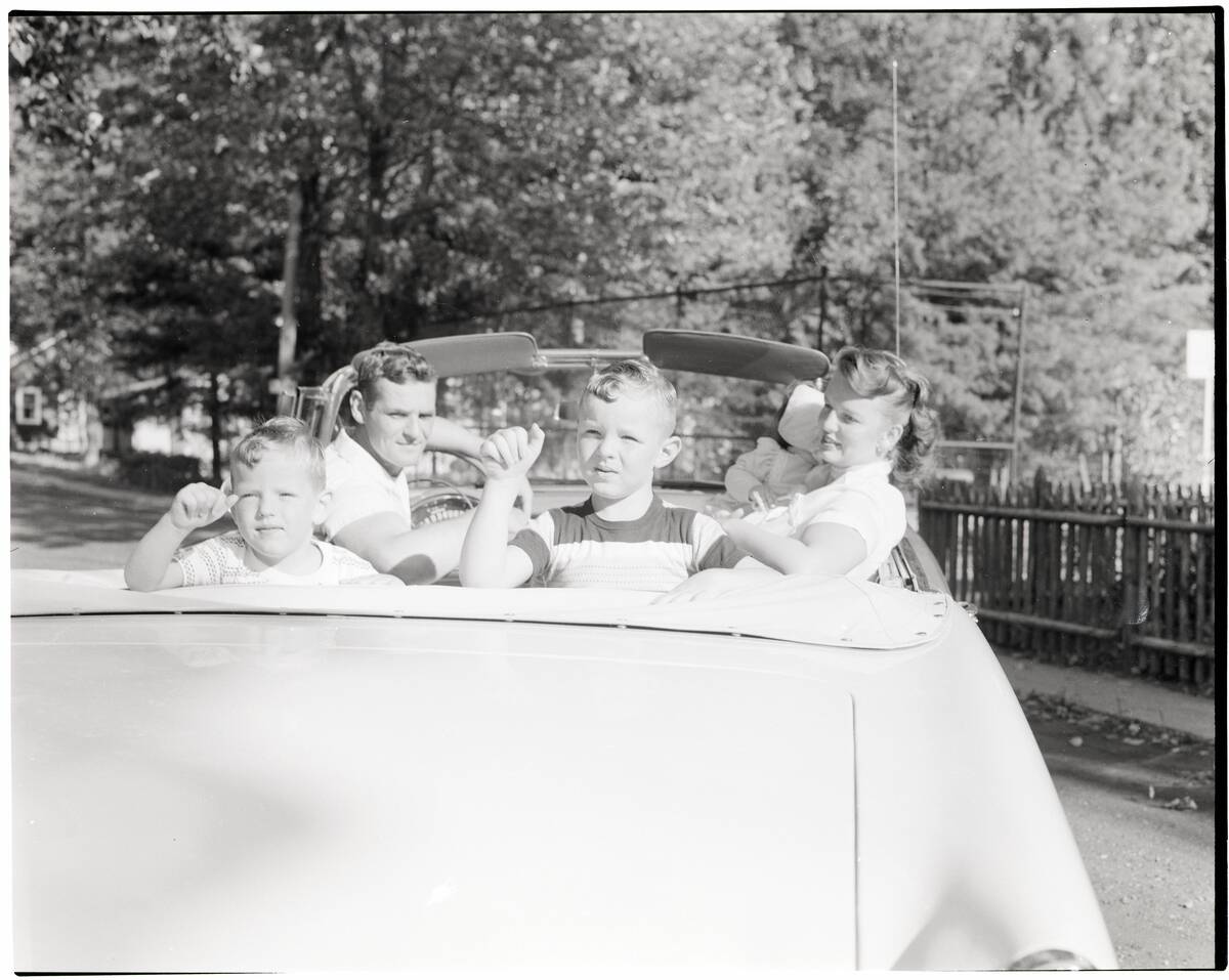 Family Seated in Convertible