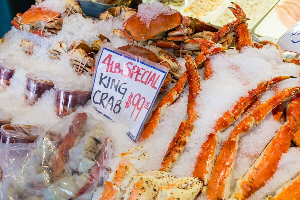 Fresh King Crab on ice for sale at the famous Pike Place Fish Market in downtown Seattle, Washington