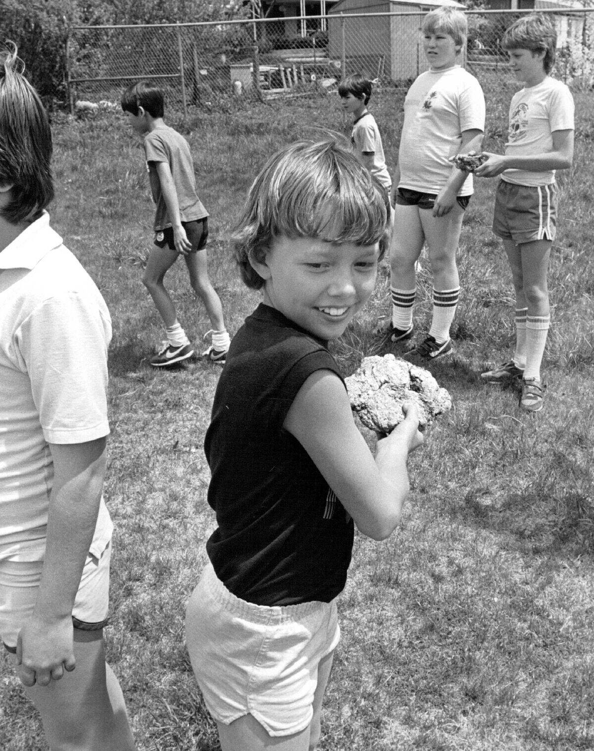 MAY 23 1984; Chris Stiner shows how to throw a cow chip that is large and flat.;
