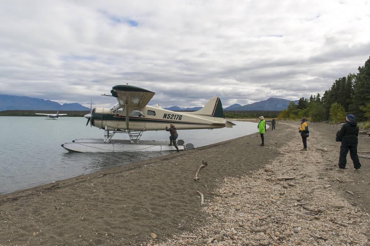 People boarding a floatplane at the beach of Naknek Lake...